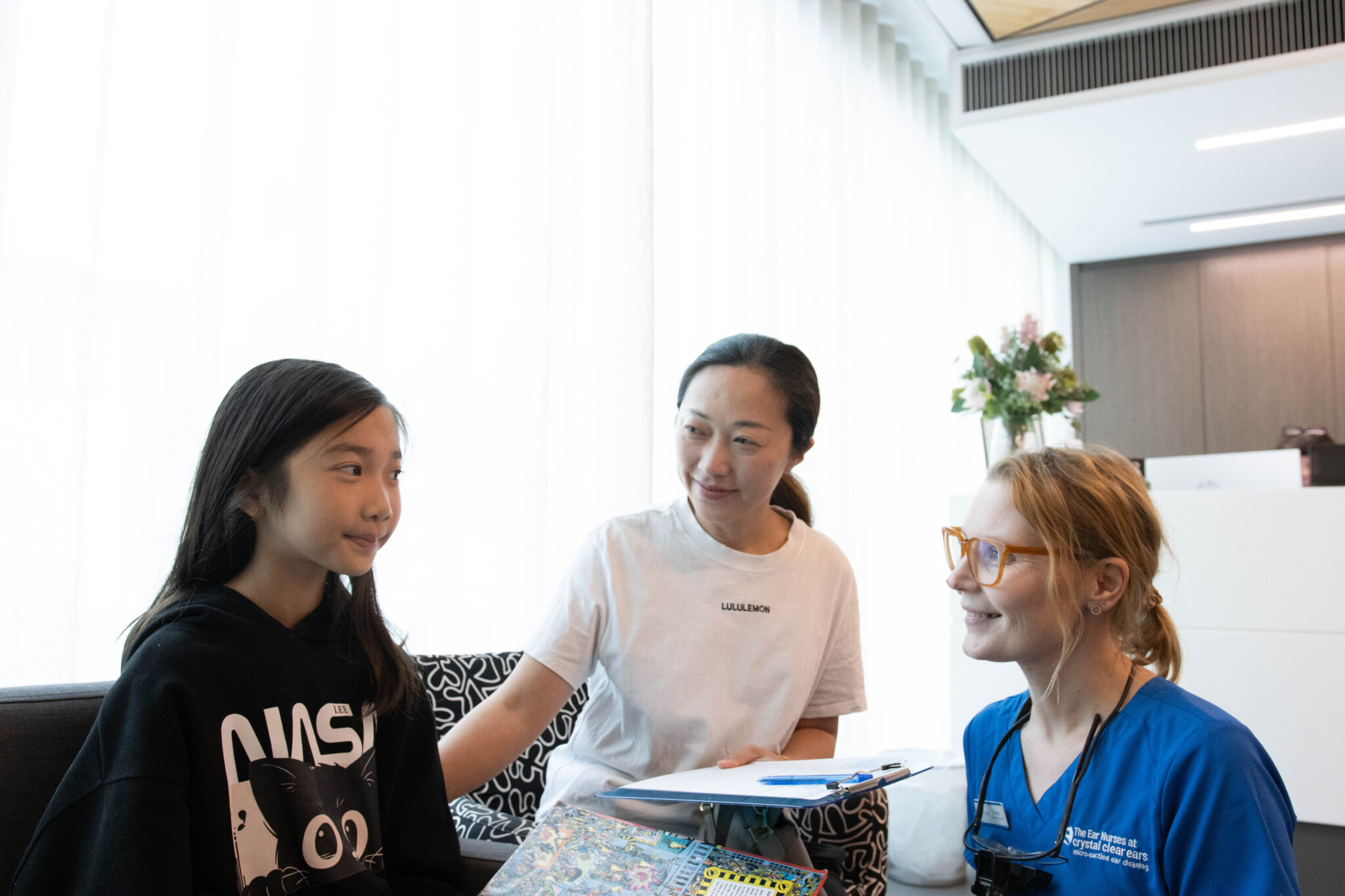 Ear Nurse speaking with patient